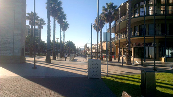 Picturesque Glenelg. Another view of Mosely Square., looking at it from beachside. Jetty Road, Glenelg’s high street, is in the background. On the right is The Grand, straight ahead is where the trams dock, to the left is another memorial commemorating the proclamation of South Australia