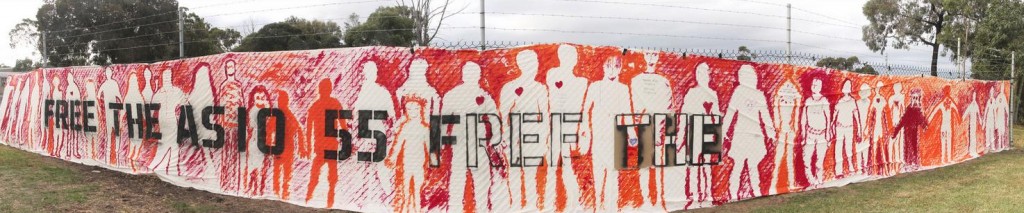 Panorama of completed banner: 55 silhouettes for the 55 refugees in ASIO immigration detention limbo. Photo credit Takver 