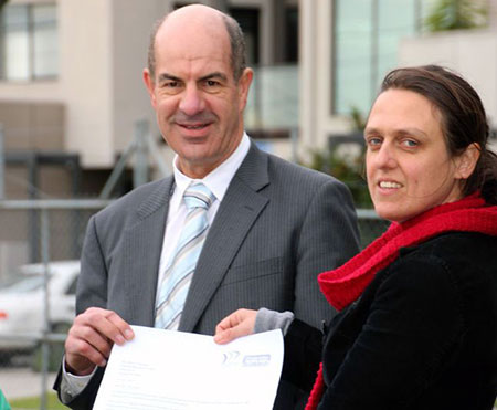 Kelvin Thomson MP receiving a petition from Ellen Roberts of Climate Action Moreland on 13 June 2012