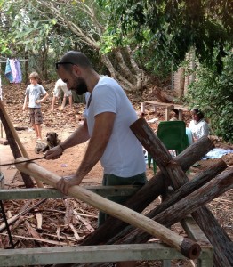 Elliot Giakalis assisting in the carving of Yidaki (didgeridoo) for Garma Festival.